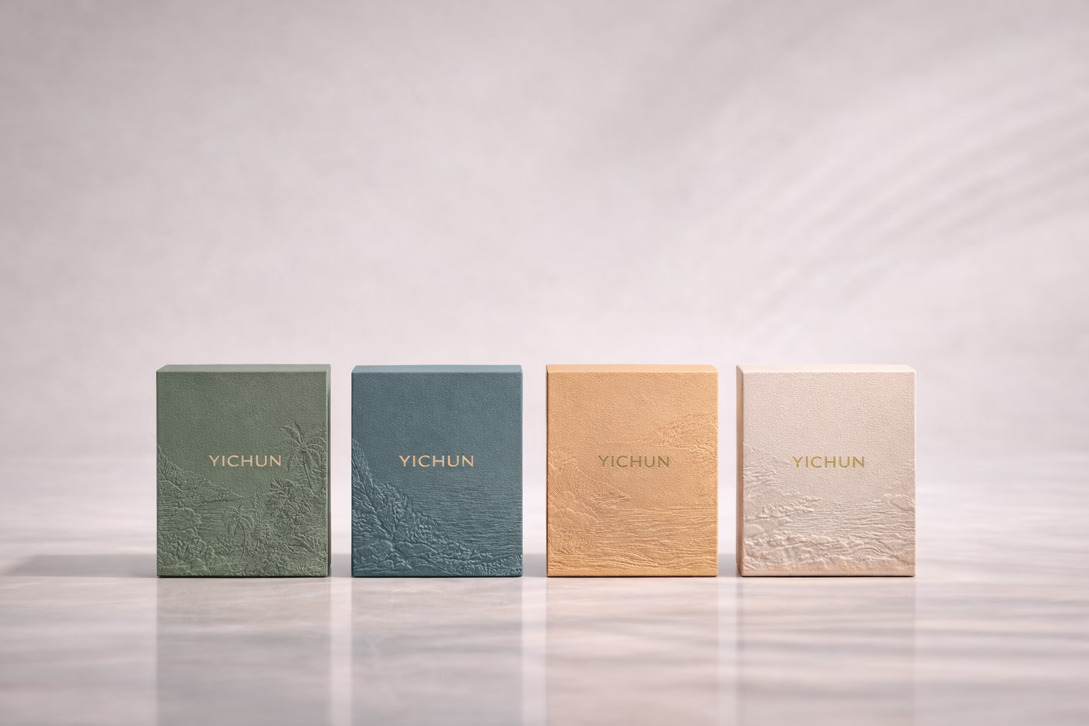 YICHUN Cape Tribulation Packaging Box Display Four YICHUN matte packaging boxes centered in a row with embossed tropical textures and gold logo inspired by Cape Tribulation landscape